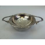 Hallmarked silver tea strainer along with the bowl. Approx weight - 72g