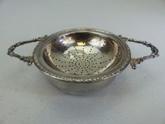 Hallmarked silver tea strainer along with the bowl. Approx weight - 72g