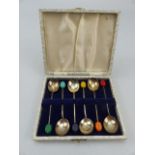 Set of six hallmarked silver cased coffee spoons with bean finials.