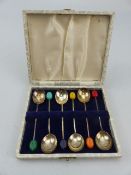 Set of six hallmarked silver cased coffee spoons with bean finials.