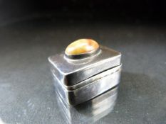 Small silver (marked 925) pill box with cabochon to lid and makers mark AN in a shield.