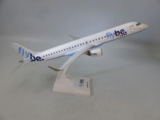 Metal bodied flybe model on stand