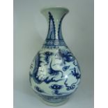 Large Chinese Blue & White Bottle shaped vase depicting dragons and a six figure character mark to