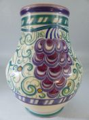 Poole Pottery 1920's large bulbous vase decorated with grapes. fully marked to base. Approx 21cm