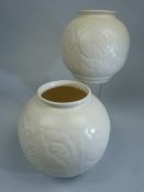 Spode's Velamour pair of globular pots decorated in relief with flowers in a cream glaze. Approx