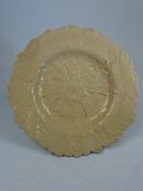 Victorian Pottery earthenware moulded plate with central flower and leaf decoration.