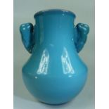 Poole Pottery Early vase with twin handles with a Chinese Blue style outer glaze and darker blue