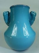 Poole Pottery Early vase with twin handles with a Chinese Blue style outer glaze and darker blue