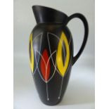 1950's Brentleigh Ware black vase with handle - having a bright yellow interior and decorated with