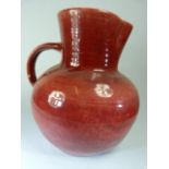 Brannam, Barnstaple, Red ground jug of large form. Stamped Royal Barumware.