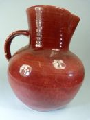 Brannam, Barnstaple, Red ground jug of large form. Stamped Royal Barumware.