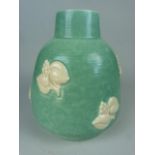 Poole Pottery Freeform Globular squat vase with applied vine and leaf decoration on a turquoise