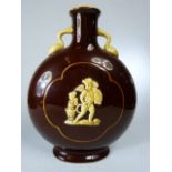 Continental moonflask in a brown glaze with applied Putti in relief
