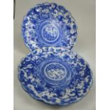 Pair of Scallop edge Japanese Blue and White plates depicting scenes of oriental men in a circular