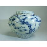 Chinese blue and white squat vase. Depicting blossomed trees with trailing floral borders. No