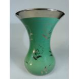 Wedgwood Veronese Ware green ground flare vase. Impressed marks to base and decorated with floral
