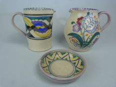 Small Poole Pottery Collection - two jugs and a Pin dish. (1) Bulbous red bodied jug decorated in