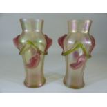 Loetz style pair of iridescent vases with applied green and pink trailing flowers