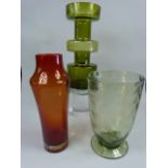Holmgaard green glass vase along with a Red Holmgaard vase and one other.