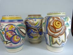 Poole Pottery a group of three 1920's similar sized floral designed vases. Patterns PI, 436/2, CU.