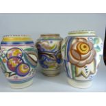 Poole Pottery a group of three 1920's similar sized floral designed vases. Patterns PI, 436/2, CU.