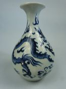 Japanese blue and white bottle vase of squat form. Depicting three clawed dragon. No markings.