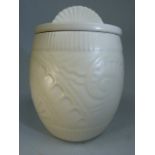 Spode's Velamour lidded pot decorated in relief with rolling waves with a cream Glaze approx