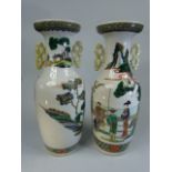 Japanese pair of twin handled vases decorated in oriental enamelled scenes.