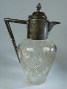 Cut Glass Claret Jug in the Manner of Christopher Dresser with Pewter fittings and star cut base.