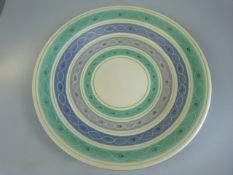 Poole Pottery 1950's Freeform charger decorated in banded purples and greens. approx diameter 33cm