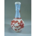 Peking glass bottle vase with enamelled blue and red decoration. Decorated with butterflies and