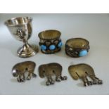 Indian silver - to include two napkin rings mounted with cabachon stones and three elephants etc