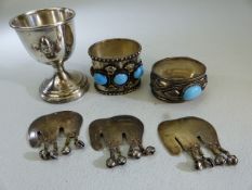 Indian silver - to include two napkin rings mounted with cabachon stones and three elephants etc