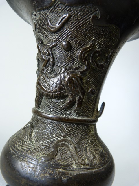 Oriental Bronze fluted vase carved in relief with Foo Dog and warrior with sword. Small amount of - Image 3 of 3