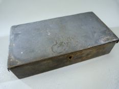 Oriental Pewter box with single marking to front. Lightly decorated with flowers to top.