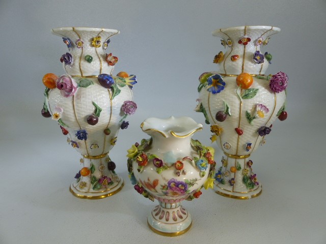 Meissen pair of 19th century floral encrusted urns. Also decorated with fruits. Both with Meissen