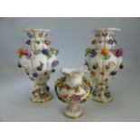 Meissen pair of 19th century floral encrusted urns. Also decorated with fruits. Both with Meissen