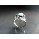 14ct white gold opal and diamond ring