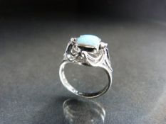 14ct white gold opal and diamond ring