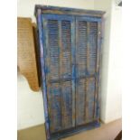 Moroccan heavily distressed two door eight panelled cupboard with two shelves and bolt lock