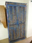 Moroccan heavily distressed two door eight panelled cupboard with two shelves and bolt lock