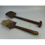 Two wooden handled military spades. One marked to blade 'Thomas 1900'