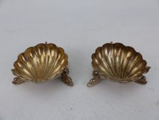Pair of unusual silver plated salts in the form of shells on dolphin feet