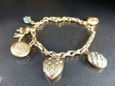 9ct gold charm bracelet with six gold coloured charms