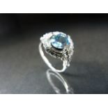 Silver CZ and blue topaz ring