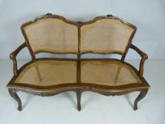 Mahogany Bergere bench with lions and ball feet