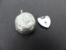 Silver locket and a silver padlock