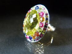 18ct White Gold multi coloured Gem stone ring. Large oval lemon yellow stone in the centre measuring