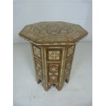 Hexagonal side table with decorative inlay of mother of pearl and ivory. Imported from Morocco. Good