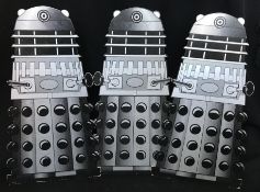 Three Dr Who Dalek cardboard shop counter display standees. Height 48cm, width 26cm approx.